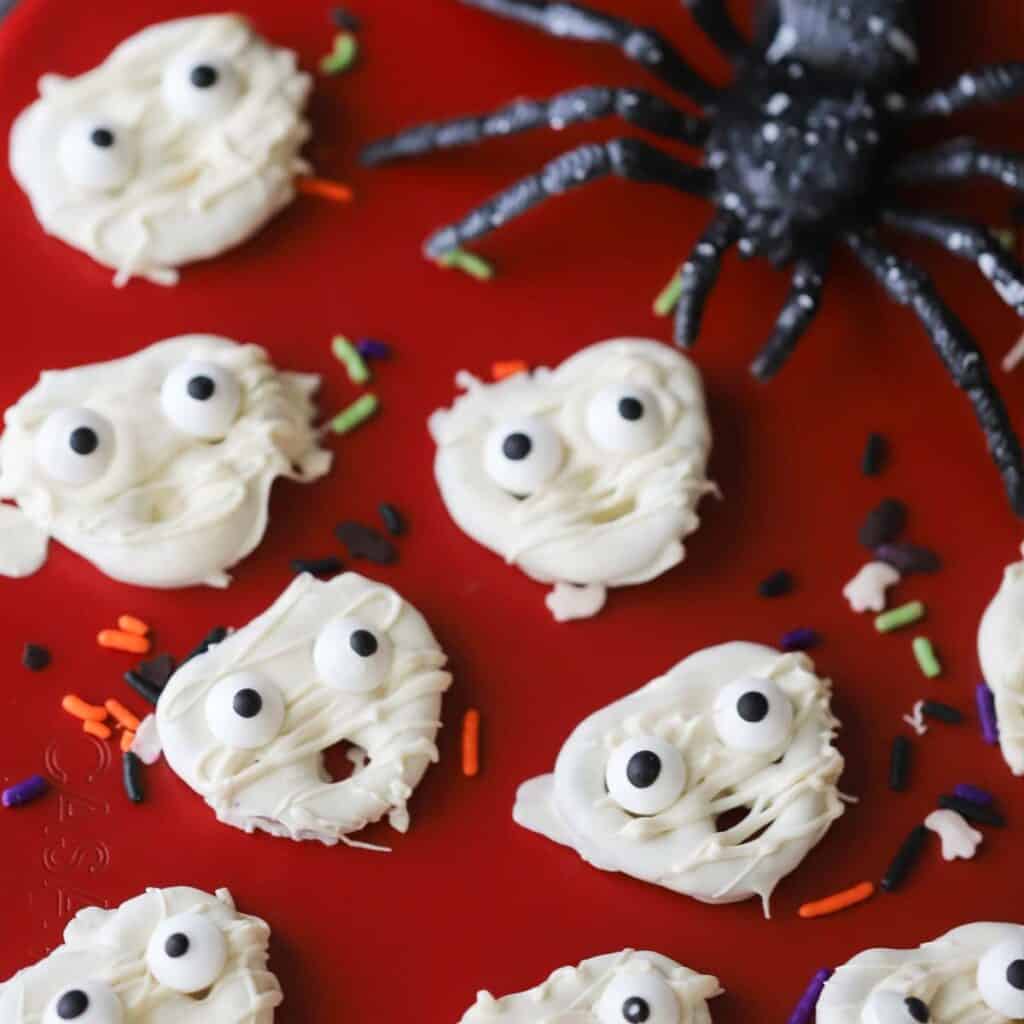 Little mummy pretzels decorated with candy eyes