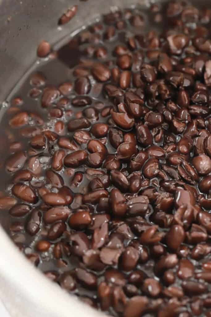 Cooked southwest Black beans chipotle recipe  in a large pot filled with water. black beans at chipotle. 