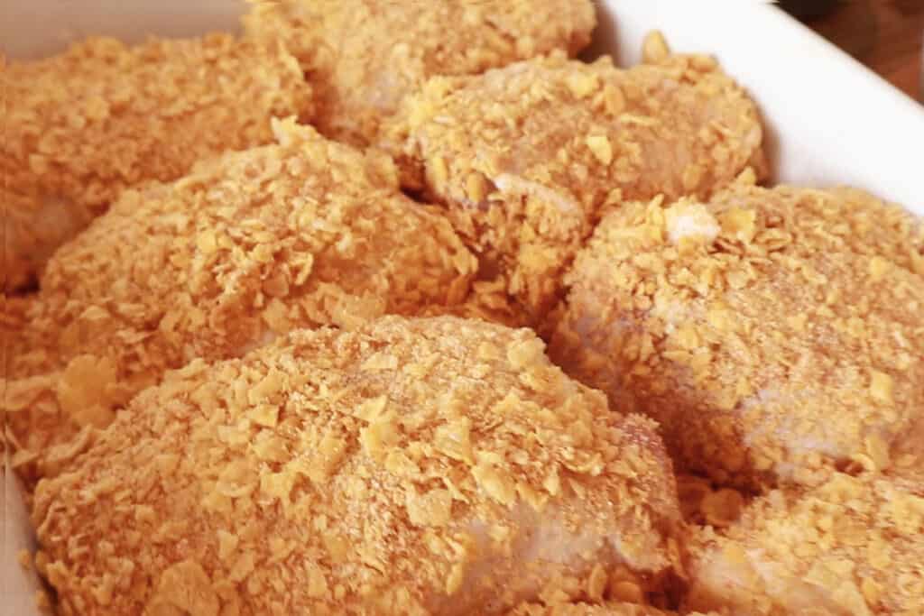 how to make baked cornflake chicken, corn flake chicken, best cornflake chicken thighs cornflake chicken recipe. 