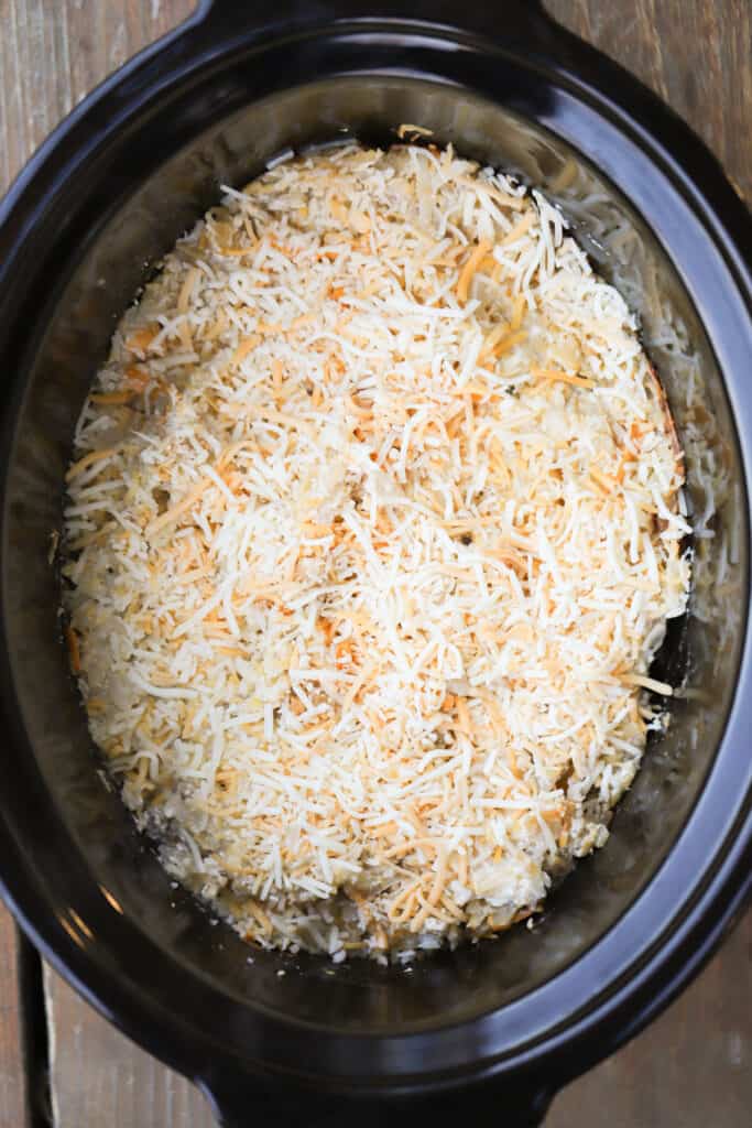 Crock pot potatoes with cheese in a slowcooker, cheesy hashbrowns in crockpot, crockpot cheesy hashbrown potatoes, diced potato casserole, 