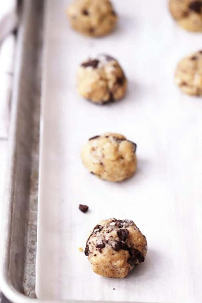 crushed oreo cookie dough on parchment paper, how to make crushed oreo recipe, recipes with crushed oreos, oreo dessert ideas. 
