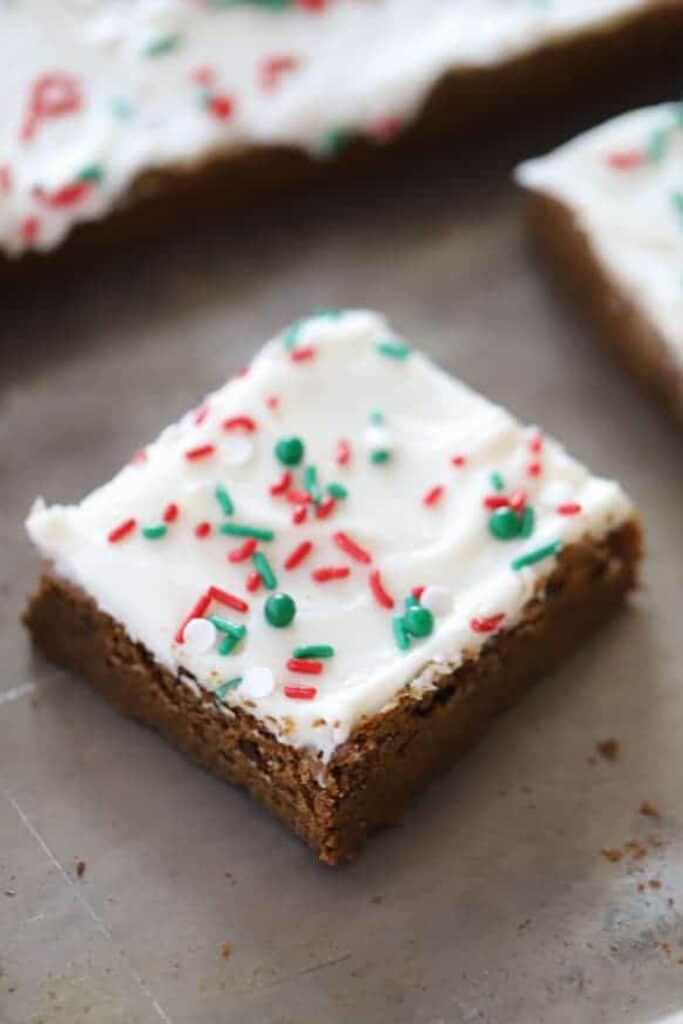 Easy Gingerbread Cookie Bars (or gingerbread squares) with festive sprinkles, the perfect molasses cookie bars recipe.