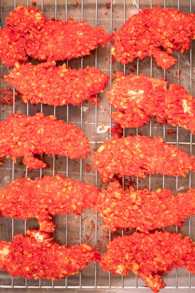 hot cheeto chicken tenders recipe on a platter with ranch dressing. hot cheetos chicken. 