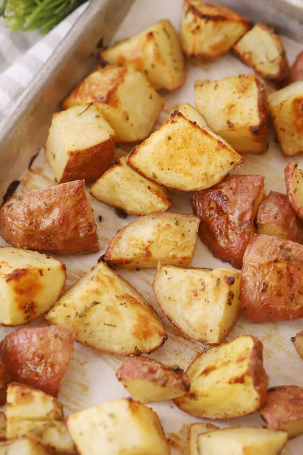 Garlic Herb Cheesy Roasted Potatoes - The Carefree Kitchen