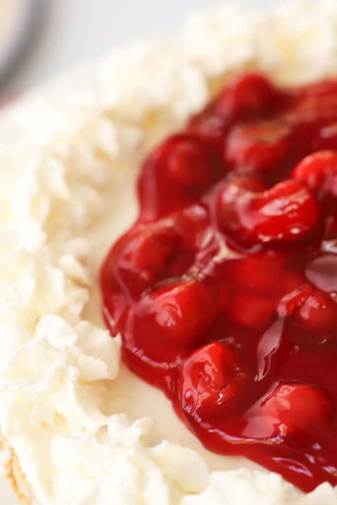 recipe for no bake cheesecake with cherry topping.