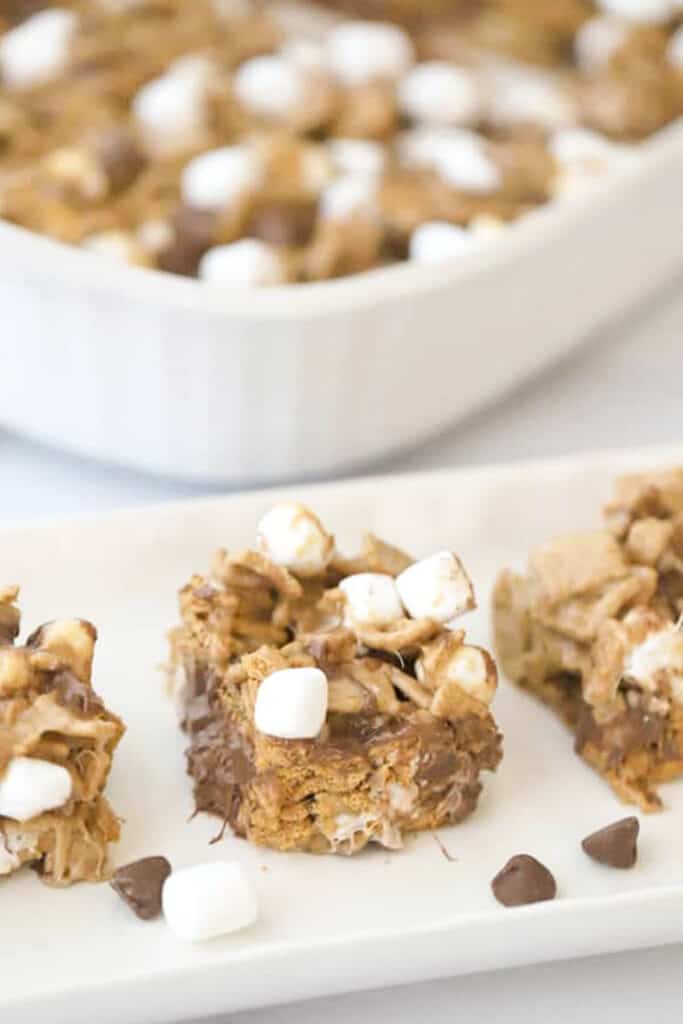Golden Grahams S'mores Bars lined up on a serving plate. Smores bar recipe golden grahams. 