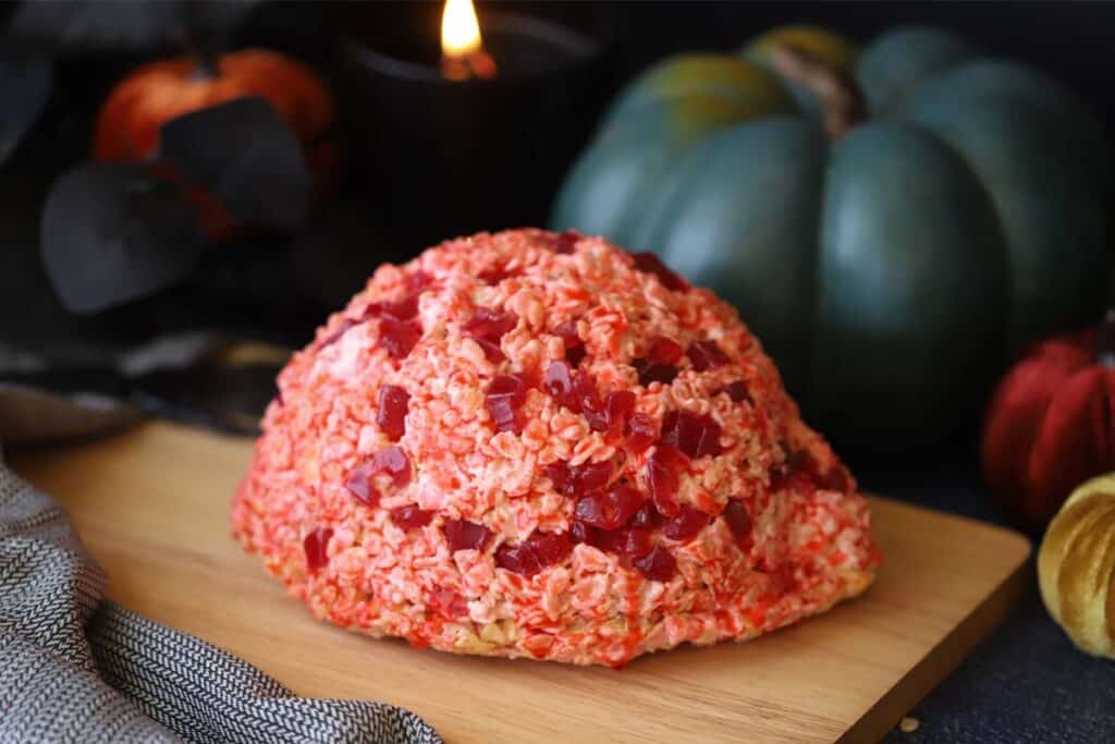 A Halloween Rice Krispies brain with fake blood and red gummy candies.