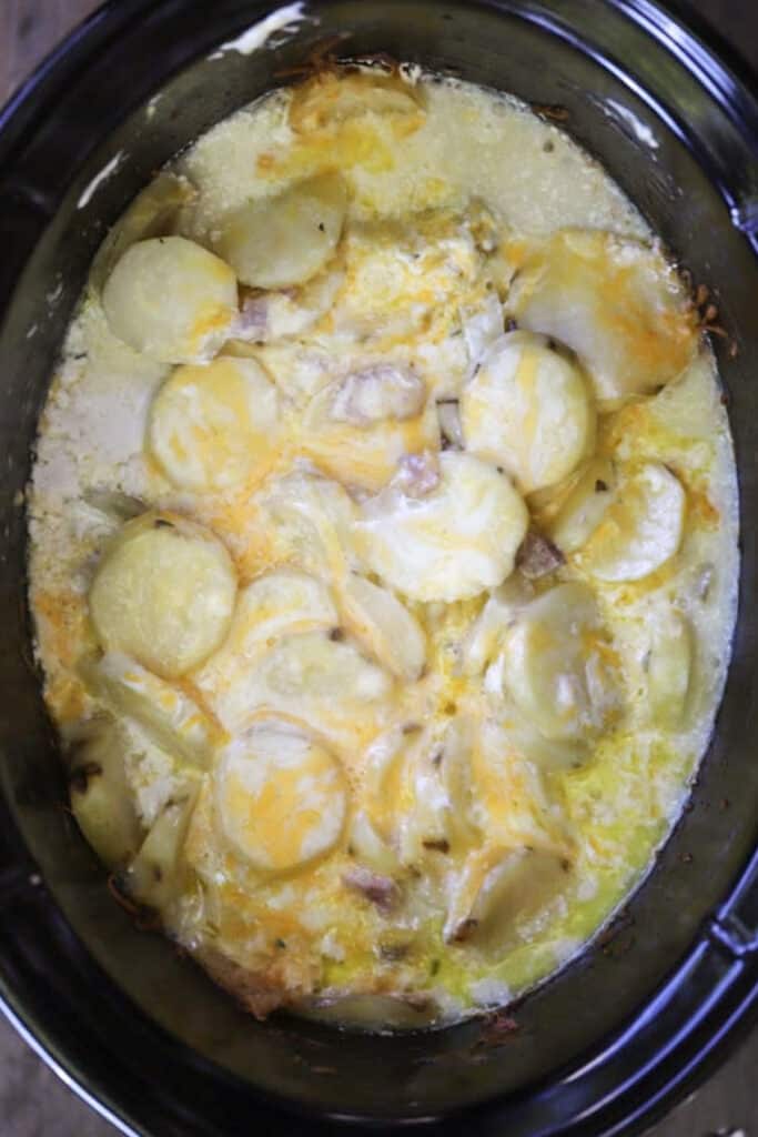 Ham and potatoes in crockpot, an easy way to make ham and cheese scalloped potatoes.