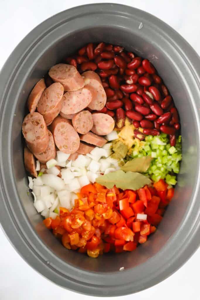 how to make this easy Slow Cooker Beans and Rice recipe. It's a rice and beans slow cooker recipe filled with chicken sausage and veggies.