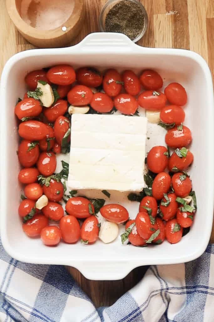 tortellini feta cheese pasta ingredients, ready to bake in a white baking dish