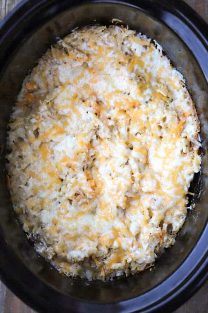 Slow cooker cheesy potatoes, cheesy crockpot potatoes, hash brown cheesy potatoes crockpot, crockpot cheesy hash browns. potato cheesy casserole, shredded potato recipes. 