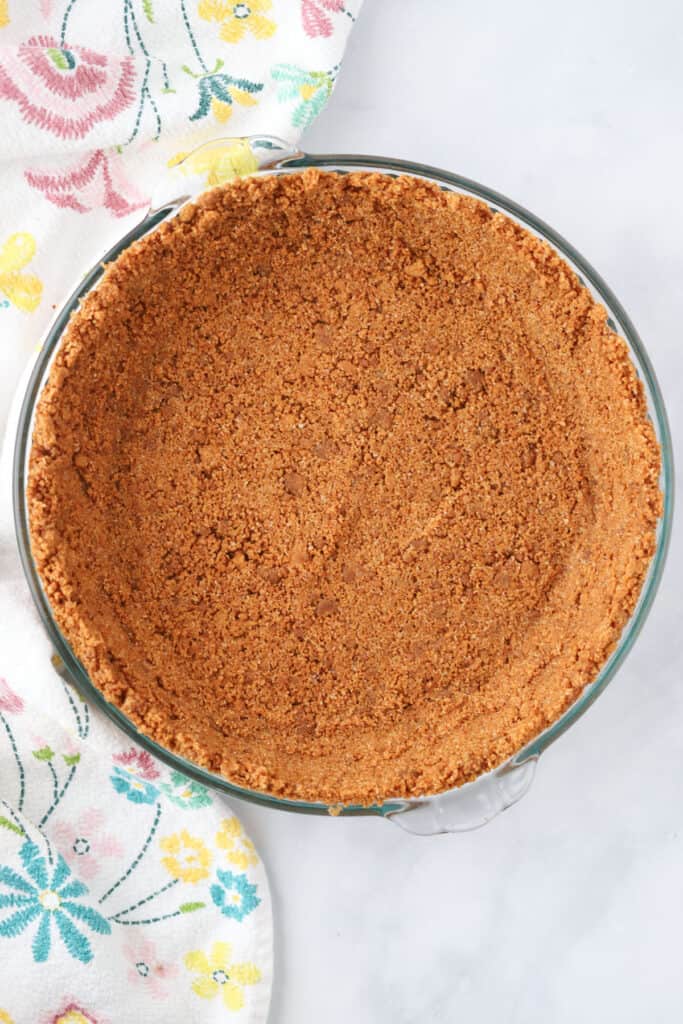 No Bake Biscoff Pie Crust in a pie dish, an easy 3 ingredient pie crust recipe made from biscoff cookies.