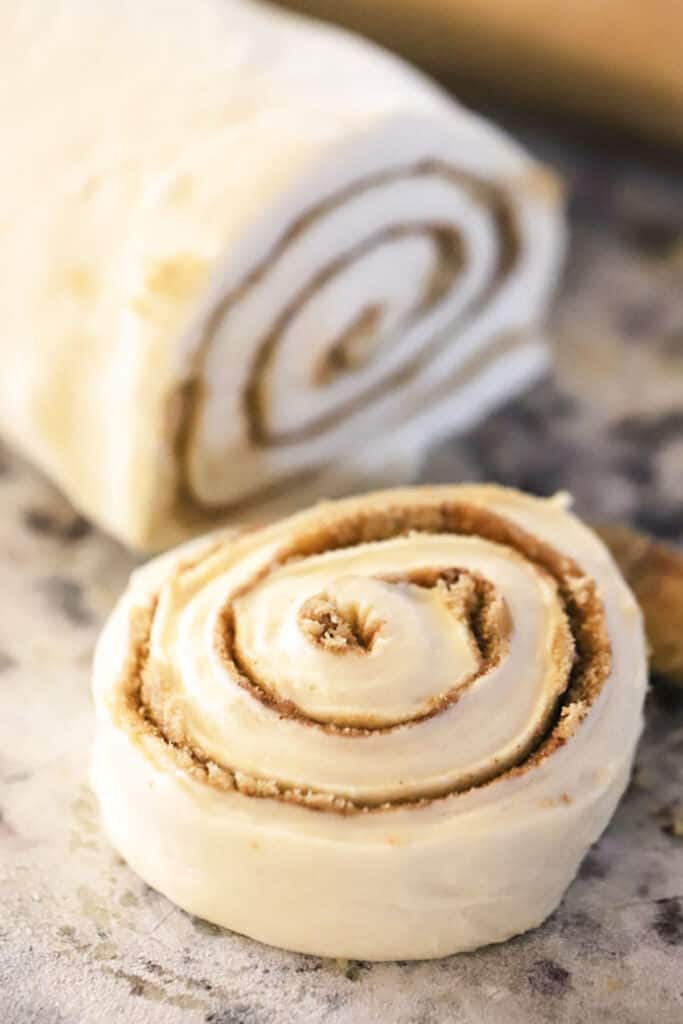 how to make cinnamon rolls from scratch, a sliced cinnamon roll ready to bake.