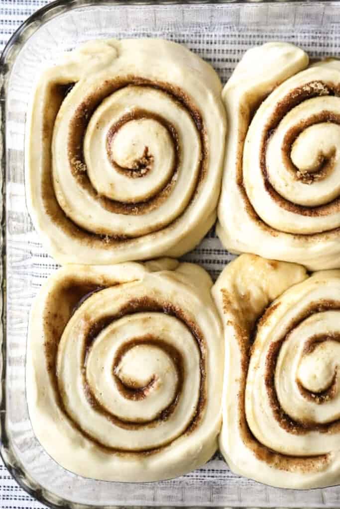 cinnamon rolls rising in a baking dish, homemade cinnamon rolls recipe (tasty). You can use this recipe to make the cinnamon roll dough premade, then bake the next day.