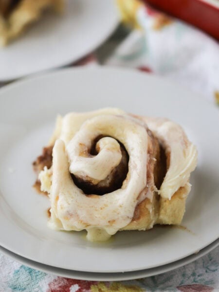 cinnamon rolls rising in a baking dish, best cinnamon roll recipe, best homemade cinnamon rolls.