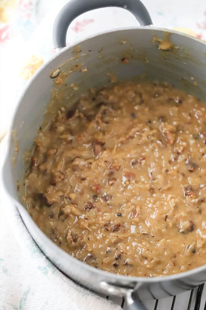 Easy German Chocolate Frosting in a large pot, ready to top German Chocolate Cake.