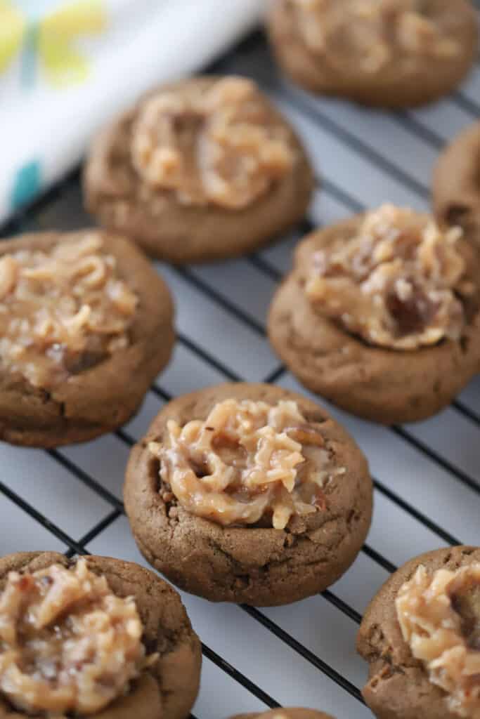 A wire cooling rack with german chocolate cookies.