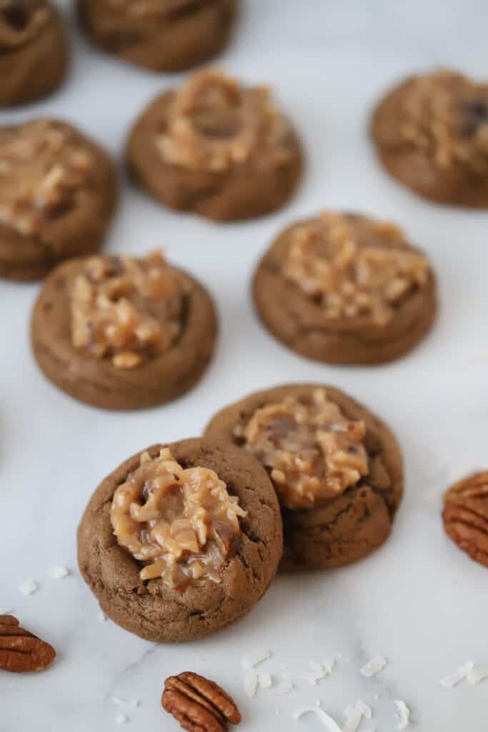 soft and chewy chocolate cookies topped with german chocolate frosting, the frosting is made with caramel, coconut, and pecans.