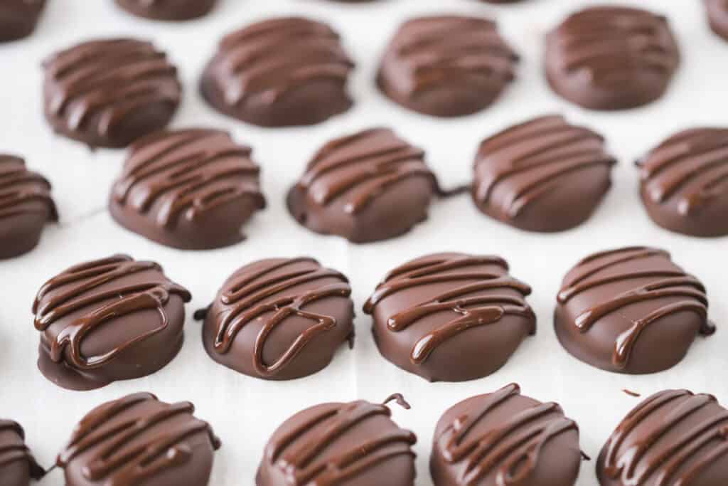 A tray of finished chocolate covered Peppermint Patty Candies.