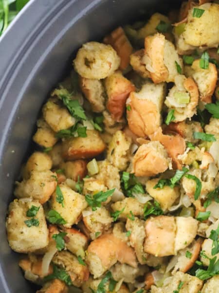 A slow cooker filled with Thanksgiving stuffing.