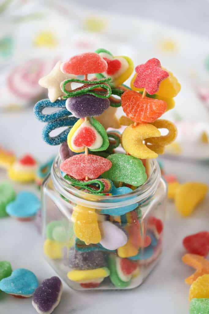 A jar with DIY Candy Kabobs, candy skewer.