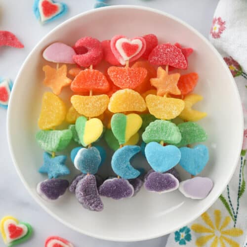 a plate full of candy kabobs