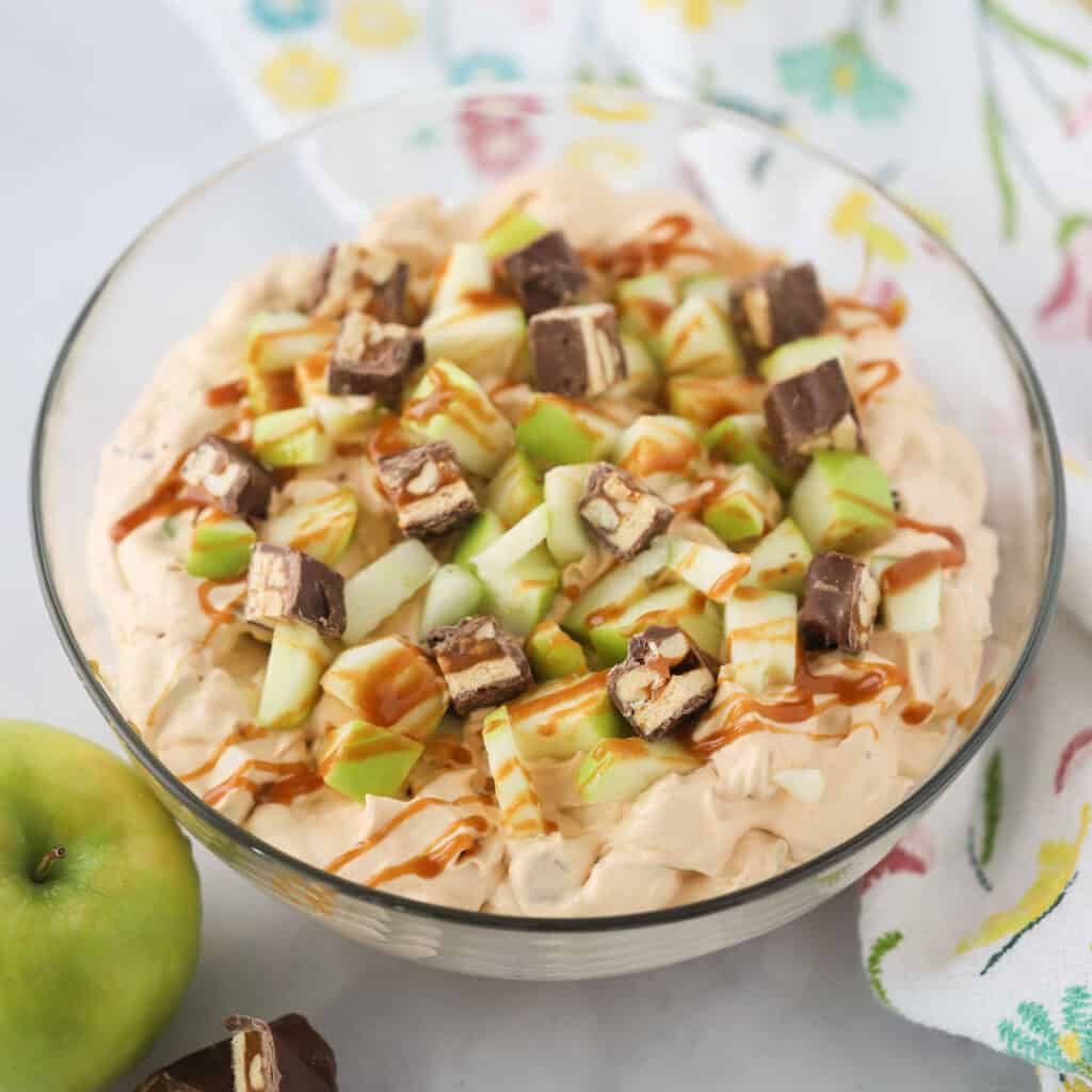 A bowl full of snickers apple salad.