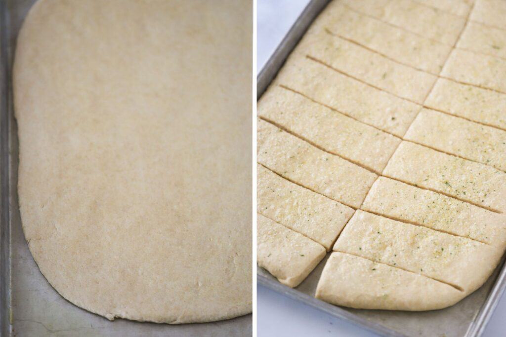 Homemade breadsticks dough rolled out and cut into rectangles on a baking sheet.