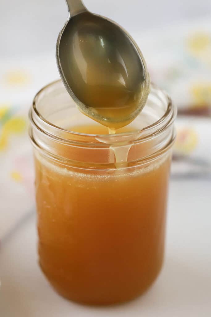A jar full of coconut buttermilk syrup, an easy homemade pancake syrup.