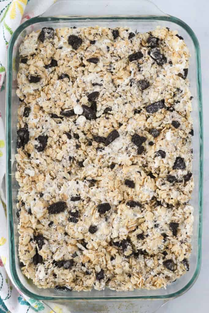 A large baking pan full of Oreo Krispie Treats ready to cut into squares.