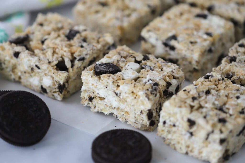 Oreo Rice Krispies Squares lined on a tray covered with parchment paper.