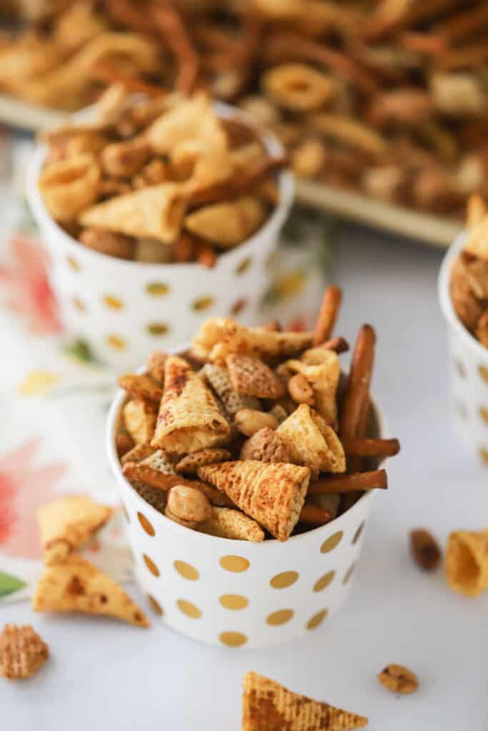 Little decorative cups full of this Chex Party Mix recipe.