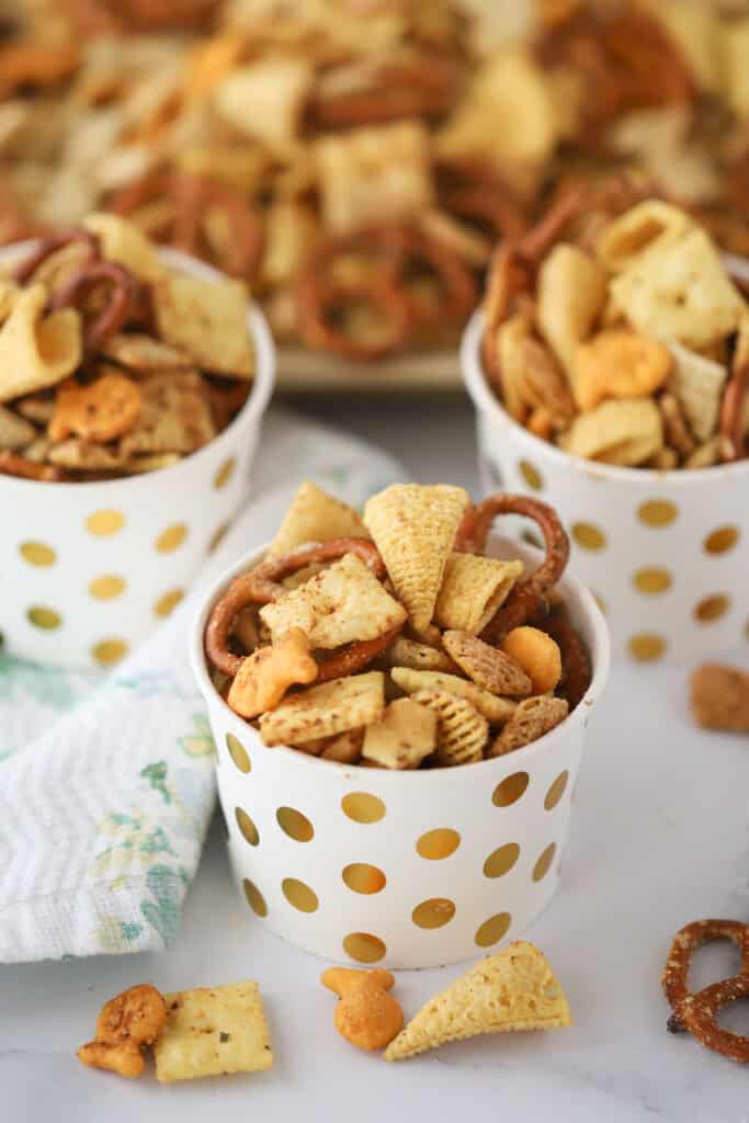 Little decorative cups filled with this ranch chex mix recipe.