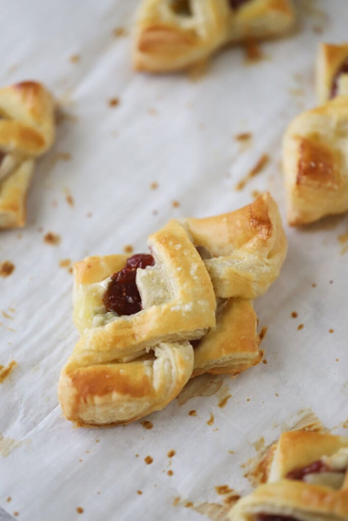 Baked brie cheese puff pastry bites filled with fig jam.