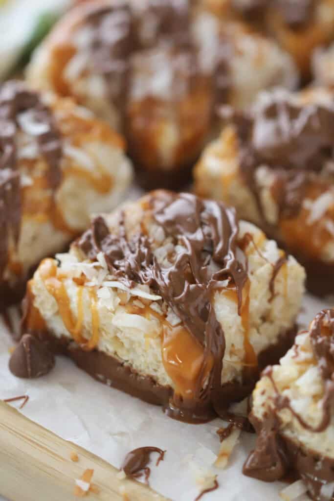 A tray with squares of Coconut Rice Krispies Treats covered in caramel and chocolate.