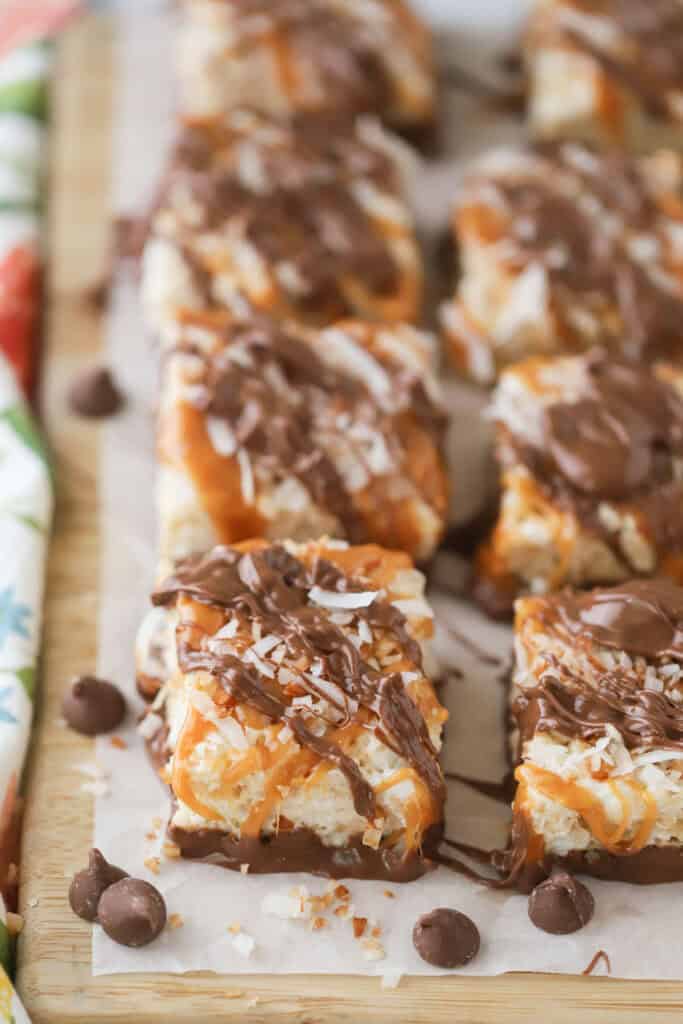 Samoa Rice Krispie Treats cut into squares on top of wax paper.