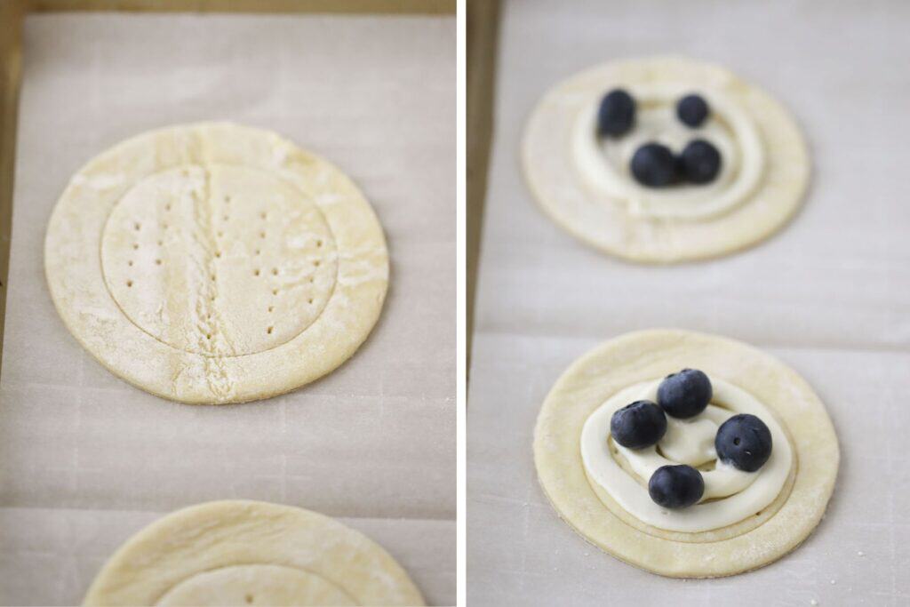 Puff pastry dough cut into circles with cream cheese filling and fresh blueberries over the top.