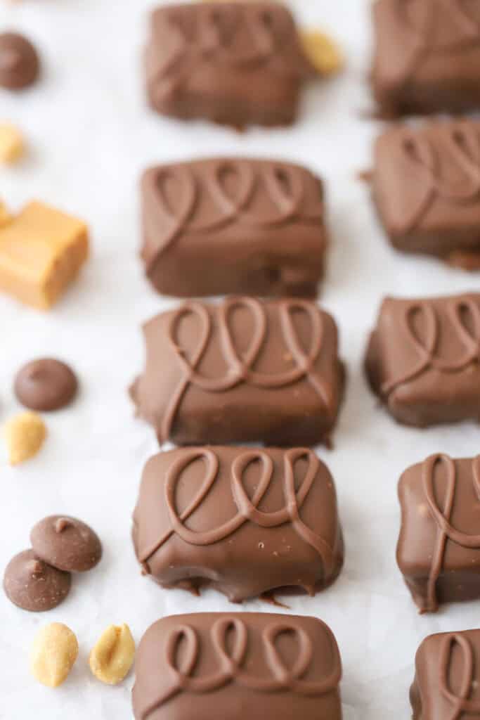 Chocolate covered candy bars with drizzled chocolate over the top.