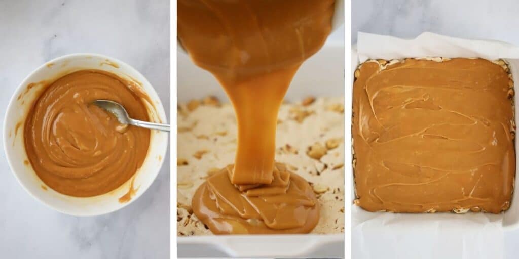 Pouring melted caramels over the top of a nougat layer to make homemade Snickers bars.