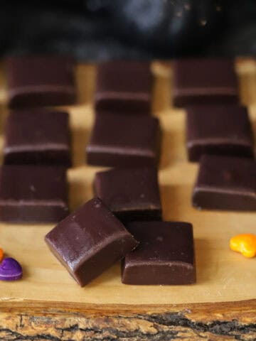 black licorice caramel candies on a serving tray