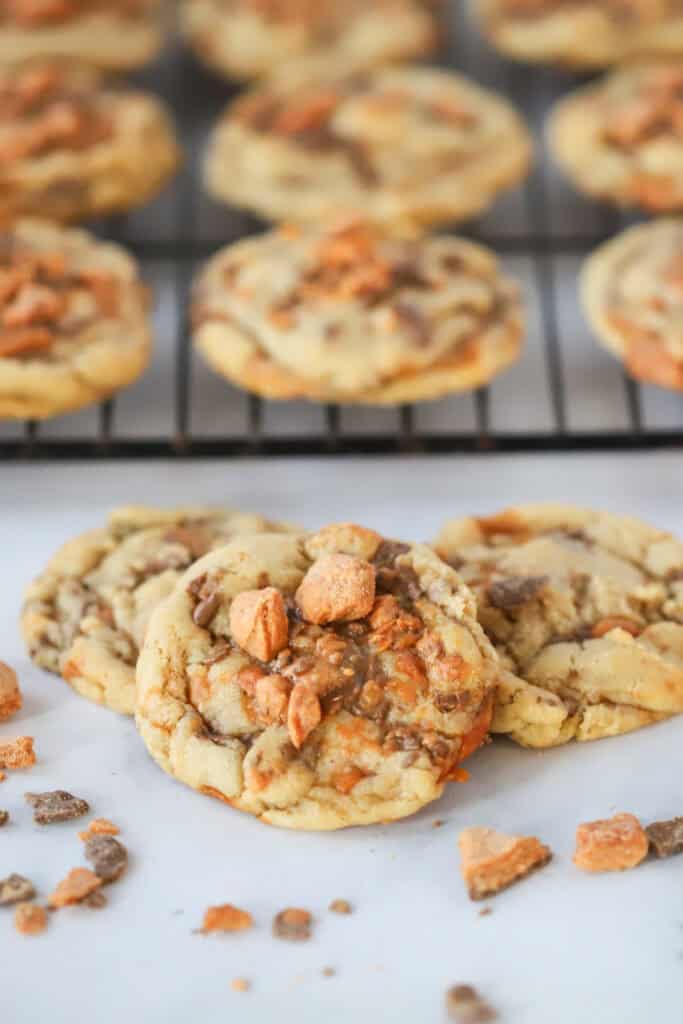 Butterfinger cookies cooling on a wire rack.