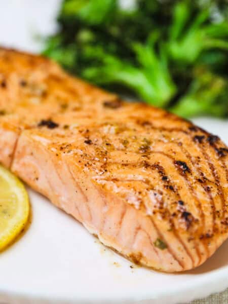 lemon garlic salmon recipe on a white plate and broccoli