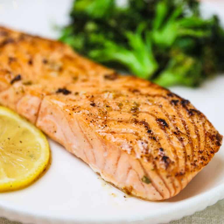 lemon garlic salmon recipe on a white plate and broccoli