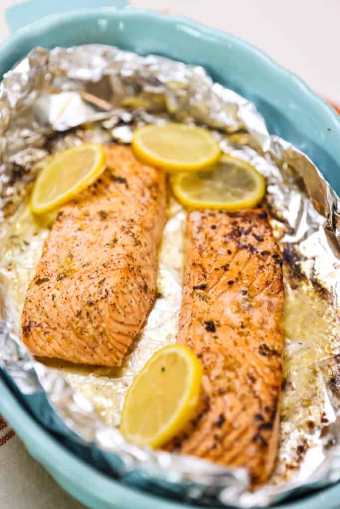 Just cooked lemon and garlic salmon filets in foil with lemon slices.