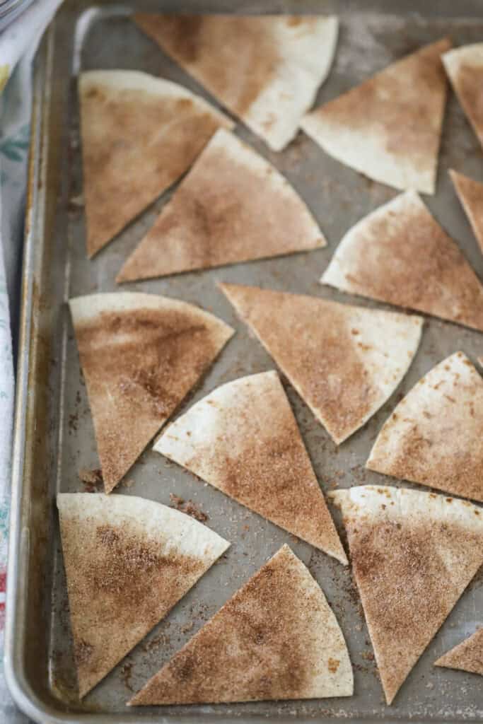 Triangles of tortilla topped with cinnamon and sugar.