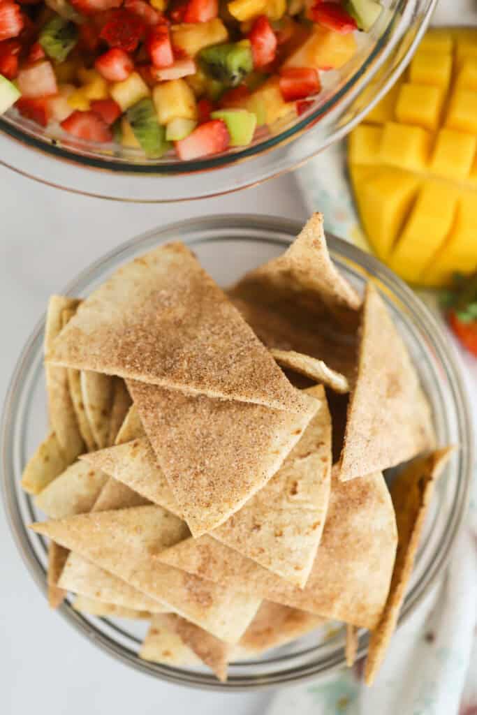 Cinnamon sugar tortilla chips in a glass bowl.