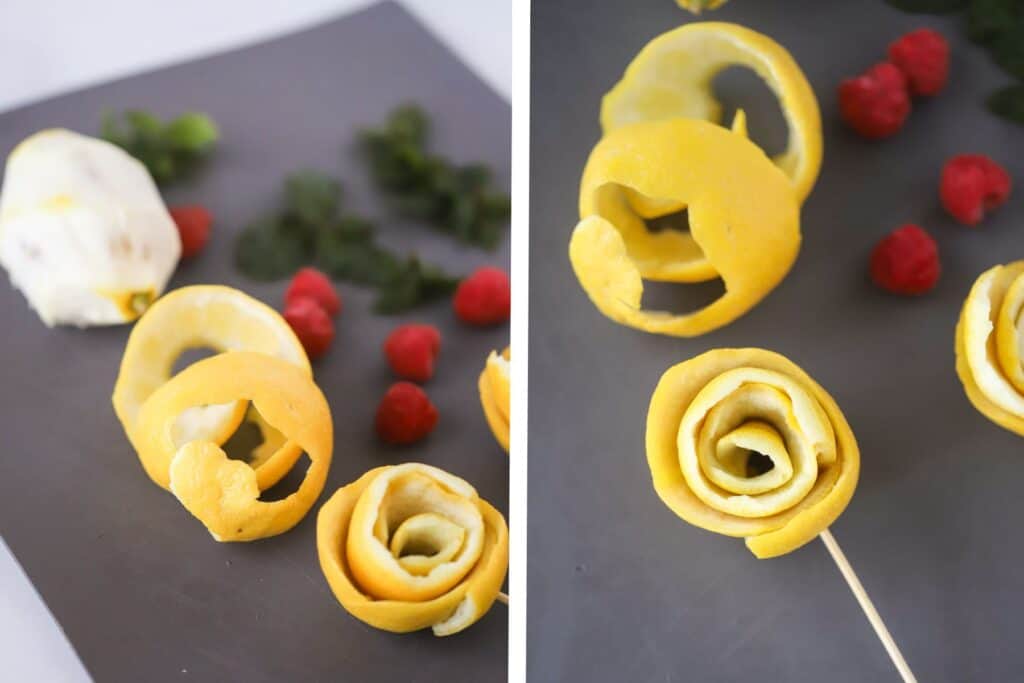 Lemon peels curled into rosette shapes and stuck with a wooden skewer.