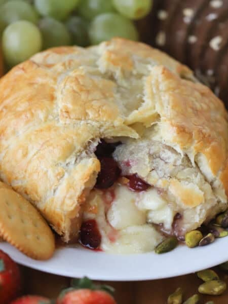 Cranberry and Brie Puff Pastry on a plate with dippers.