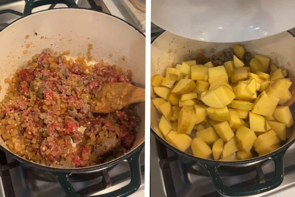A Dutch oven pot with cooked onions and sausage, and raw cut potatoes added to the top.