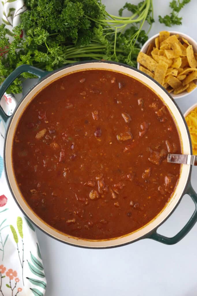 A Dutch oven full of beef brisket chili.